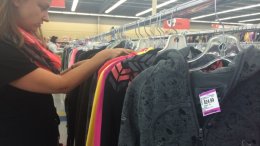 A Value Village employee sorts
